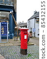 Red post on the street corner 85432155