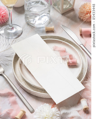 Wedding Table place with a card near pink flowers, feathers and silk ribbons, menu mockup Wedding Table place with a card near pink flowers, feathers and silk ribbons, menu mockup 85433448