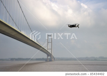 DJI drone in flight next to Humber Bridge, Hessle, Hull, Yorksire DJI drone in flight next to Humber Bridge, Hessle, Hull, Yorksire 85434402