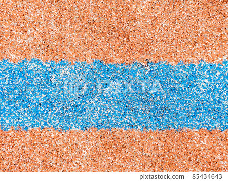 Red artifical carpet with blue border line. The outdoor ball game playfield. 85434643