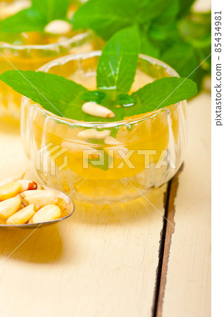 Arab traditional mint and pine nuts tea 85434981