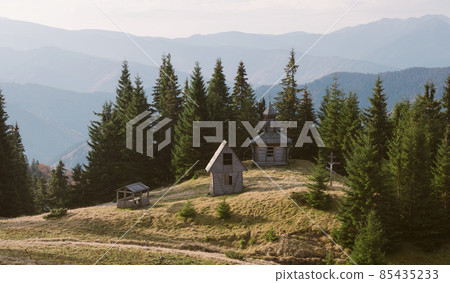 Old wooden church in a forest Old wooden church in a forest 85435233