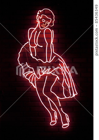 Neon light shaped into a Marilyn Monroe 85436349