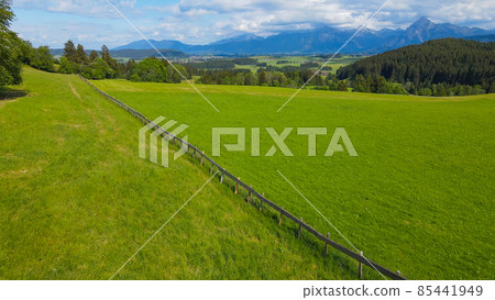 Flight over the beautiful rural landscape of Bavaria Allgau in the German Alps Flight over the beautiful rural landscape of Bavaria Allgau in the German Alps 85441949
