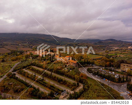 Typical landscape with small villages and farm fields in Tuscany Typical landscape with small villages and farm fields in Tuscany 85442010