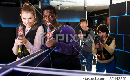 Fine laser tag players during lasertag game Fine laser tag players during lasertag game 85442861