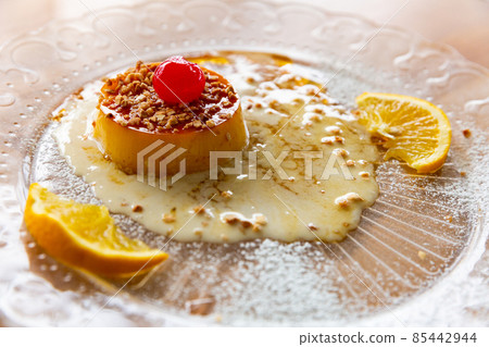 Tocino de cielo with caramel, nuts, maraschino cherry and orange 85442944