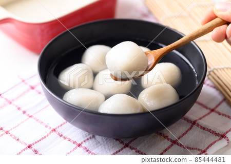 Tangyuan, Chinese dessert made of ball glutinous rice flour and filled with black sesame 85444481