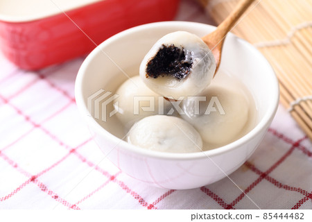 Tangyuan, Chinese dessert made of ball glutinous rice flour and filled with black sesame 85444482