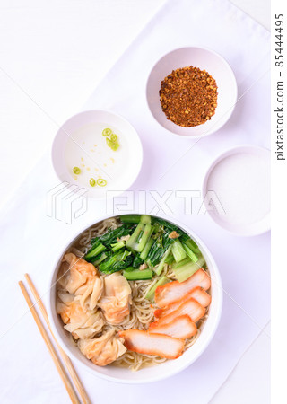 Noodles soup with wonton dumpling and grilled red pork, Asian food, Top view 85444495