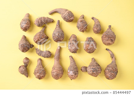 Organic taro on yellow background, Ugly vegetable concept, food trend 85444497