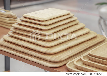 Many different beech and bamboo wooden chopping boards. Eco-friendly household goods and kitchen utensils 85446545