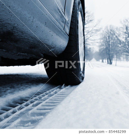 Car tire track in the snow. Concept for transport and winter tires in winter time. Car tire track in the snow. Concept for transport and winter tires in winter time. 85448299