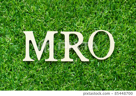 Alphabet letter in word MRO (Abbreviation of Maintenance, repair and overhaul or Maintenance, Repair and Operations) on green grass background 85448700