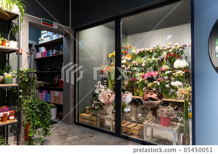 stylish flower shop interior with potted plants and fridge for premium bouquets stylish flower shop interior with potted plants and fridge for premium bouquets 85450051