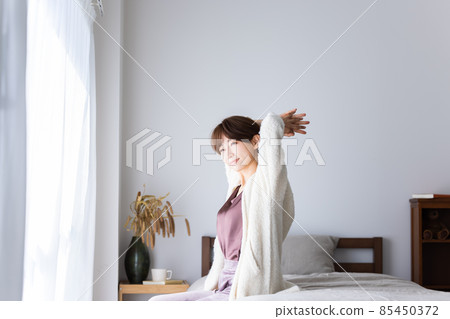 Stretching woman Stretching woman 85450372