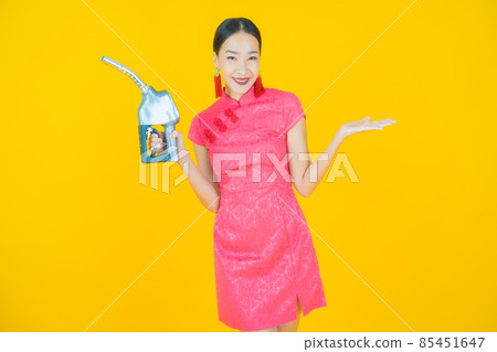 Portrait beautiful young asian woman feul gas pump Portrait beautiful young asian woman feul gas pump 85451647