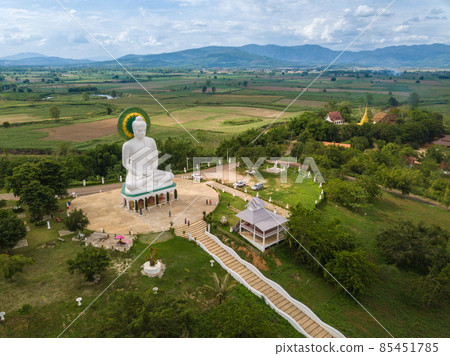 Aerial view of white big Buddha located on small hill in Wiang Kaew village of Chiang Saen district in the northern part of Chiang Rai province, Thailand. Aerial view of white big Buddha located on small hill in Wiang Kaew village of Chiang Saen district in the northern part of Chiang Rai province, Thailand. 85451785