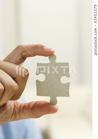 puzzle in hand puzzle in hand 85452379