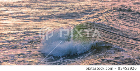 Wave breaking in the Baltic sea, evening light, background image of sea wave 85452926