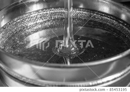 Drop of bee honey drip from hexagonal honeycombs Drop of bee honey drip from hexagonal honeycombs 85453195