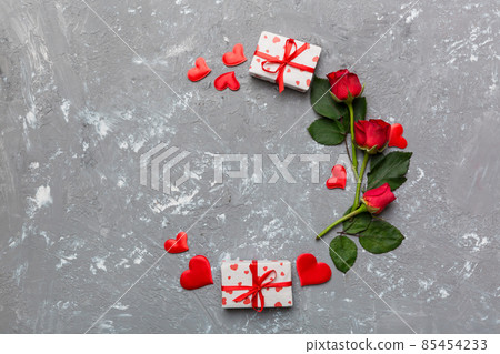 Heart made of rose, git box, heart and blank greeting card mockup on Colored background. Top view, flat lay, copy space Holiday, Mothers Day, birthday concept Heart made of rose, git box, heart and blank greeting card mockup on Colored background. Top view, flat lay, copy space Holiday, Mothers Day, birthday concept 85454233