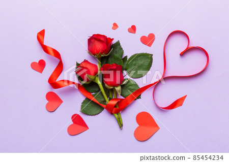 Valentine day composition with rose flower and red heart on table. Top view, flat lay, copy space Holiday concept Valentine day composition with rose flower and red heart on table. Top view, flat lay, copy space Holiday concept 85454234