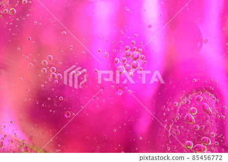 Oil circles on a colored abstract background. 85456772