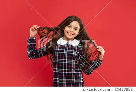 hairdresser. glad kid with curly hair. teen beauty hairstyle. female fashion model. hairdresser. glad kid with curly hair. teen beauty hairstyle. female fashion model. 85457998