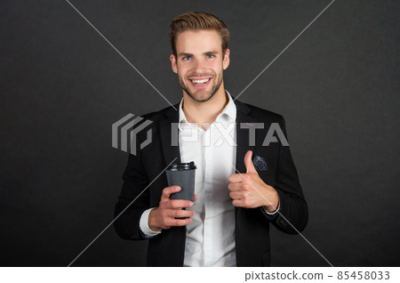 happy lawyer drink morning coffee showing thumb up on black background 85458033