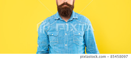 Bearded mustached man crop view in denim shirt yellow background, beard 85458097