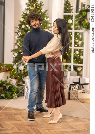 Man looking at camera dancing with woman 85459818