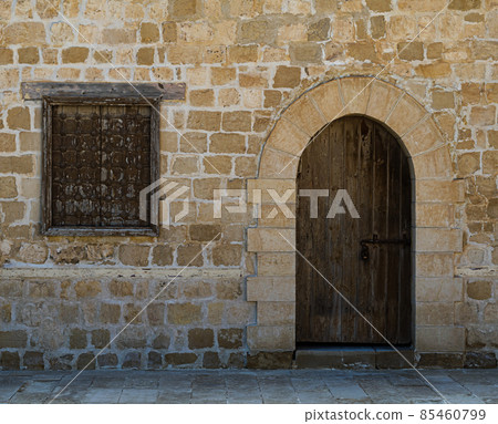 Door and window of one of the rooms surrounding the main yard of the citadel of Alexandria, Egypt 85460799