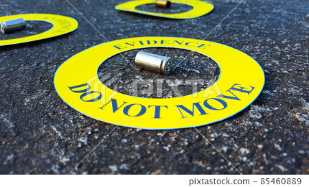 Bullet shell in middle of a yellow circle with text "evidence do not move" the circle on black background, concept for crime scene investigation Bullet shell in middle of a yellow circle with text "evidence do not move" the circle on black background, concept for crime scene investigation 85460889
