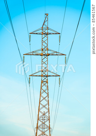 Production of fuel and electricity.Electrical networks with wires and transformers at sunset.Power transmission lines and from the power plant.Power lines with wires under voltage and electric current Production of fuel and electricity.Electrical networks with wires and transformers at sunset.Power transmission lines and from the power plant.Power lines with wires under voltage and electric current 85461567