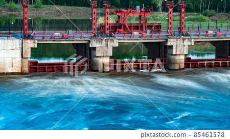 River, dam, bridge. Car and pedestrian bridge in the morning. A full-flowing river with a strong current. Clean, bubbling, fresh water.Technical construction on the river, fresh water reserves River, dam, bridge. Car and pedestrian bridge in the morning. A full-flowing river with a strong current. Clean, bubbling, fresh water.Technical construction on the river, fresh water reserves 85461578