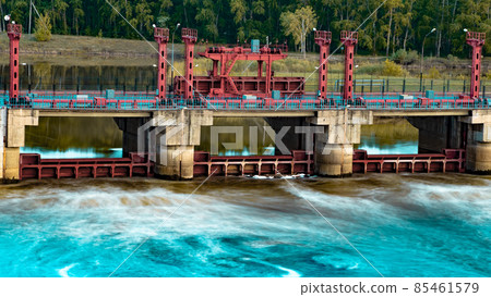 River, dam, bridge. Car and pedestrian bridge in the morning. A full-flowing river with a strong current. Clean, bubbling, fresh water.Technical construction on the river, fresh water reserves River, dam, bridge. Car and pedestrian bridge in the morning. A full-flowing river with a strong current. Clean, bubbling, fresh water.Technical construction on the river, fresh water reserves 85461579