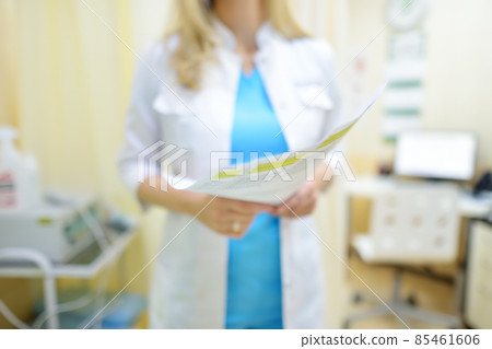 The surgeon doctor is examining a results of check up of patient and appoint plan of treatment. Practitioner at work place in medical office at the clinic. The surgeon doctor is examining a results of check up of patient and appoint plan of treatment. Practitioner at work place in medical office at the clinic. 85461606