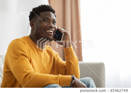 Handsome african american young man having phone conversation with girlfriend 85462749