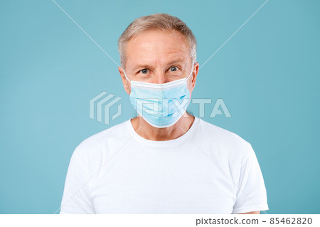 Mature Man Wearing Protective Medical Mask At Studio Mature Man Wearing Protective Medical Mask At Studio 85462820