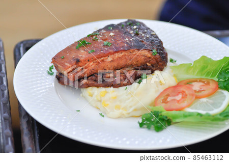 grilled pork , pork steak and beef steak. 85463112