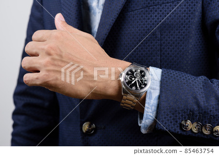 wristwatch on wrist 85463754