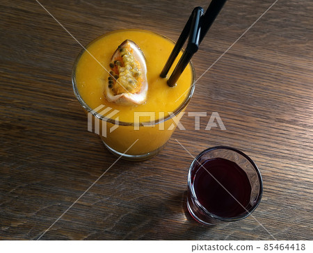 Delicious mango passion fruit smoothie Delicious mango passion fruit smoothie 85464418