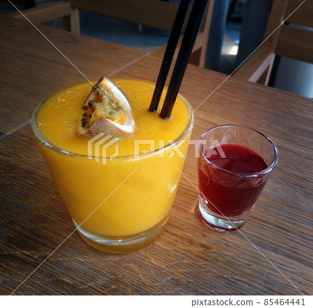 Delicious mango passion fruit smoothie Delicious mango passion fruit smoothie 85464441
