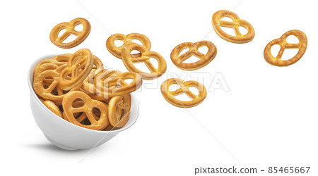 Falling salted pretzels isolated on white background Falling salted pretzels isolated on white background 85465667
