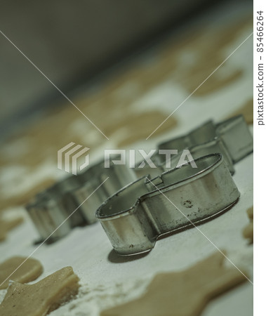 Cookie molds, with raw sliced dough on the table. Cookie molds, with raw sliced dough on the table. 85466264