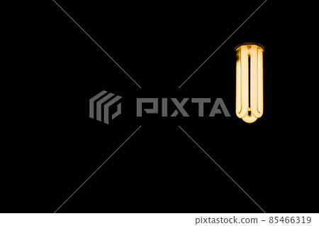 Luminous tubes of a fluorescent lamp on a black background. Selective focus, copy space Luminous tubes of a fluorescent lamp on a black background. Selective focus, copy space 85466319