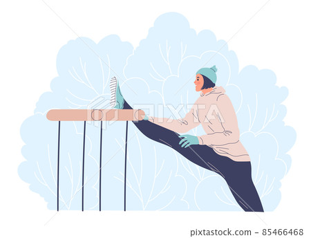 Woman working outdoors in the winter doing stretching. 85466468