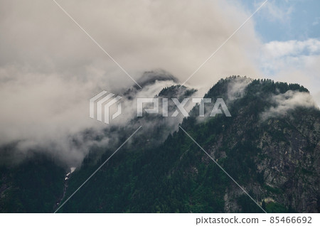 Fog in the mountain valley. Morning fog over the lake in the Altai mountains. Fog in the mountain valley. Morning fog over the lake in the Altai mountains. 85466692