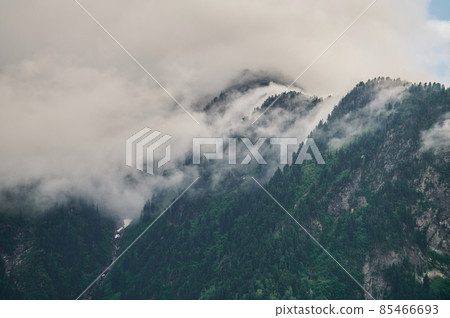 Fog in the mountain valley. Morning fog over the lake in the Altai mountains. Fog in the mountain valley. Morning fog over the lake in the Altai mountains. 85466693